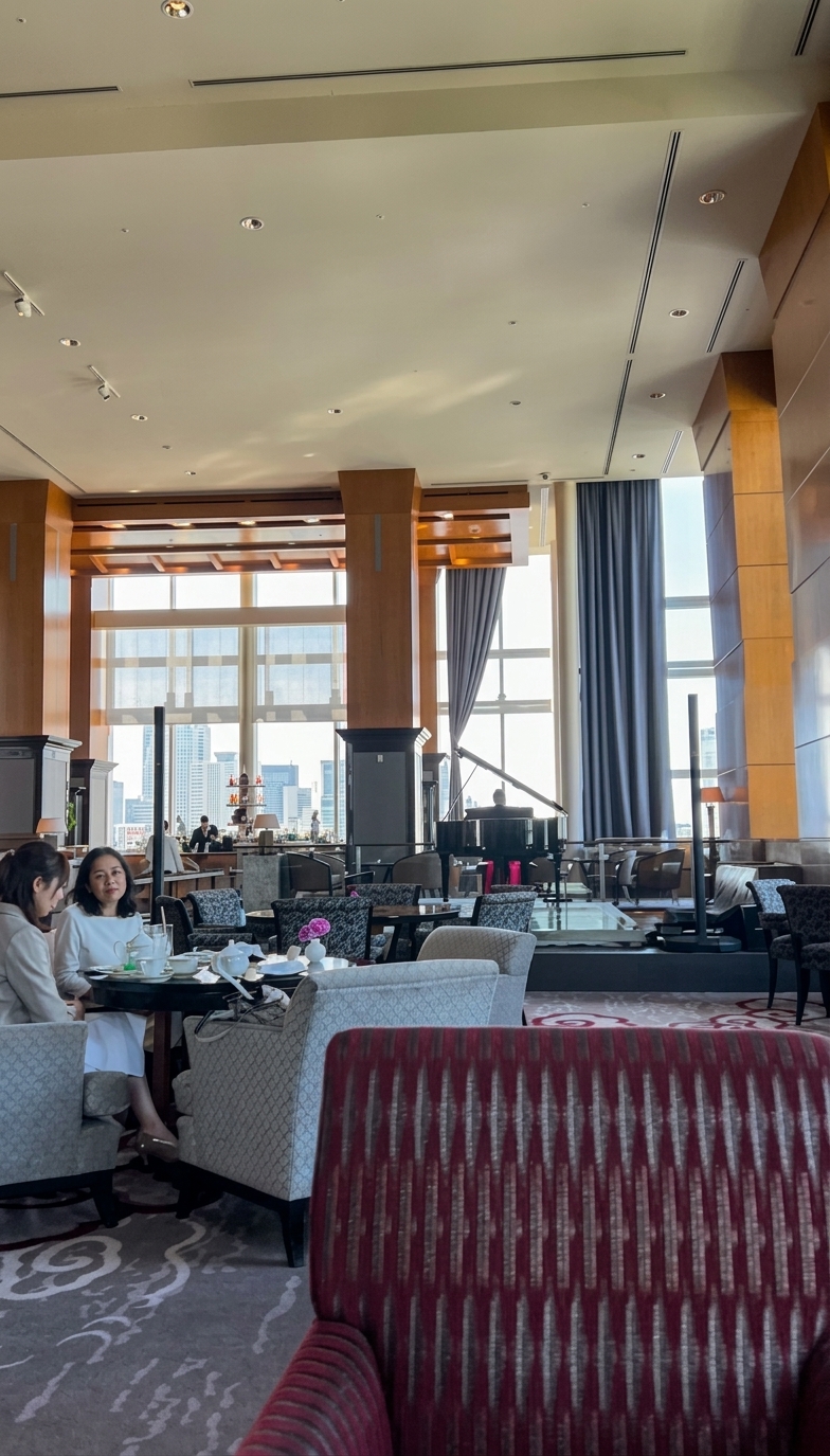 The Lobby Lounge and Bar at the Ritz-Carlton Tokyo with piano and Tokyo skyline view